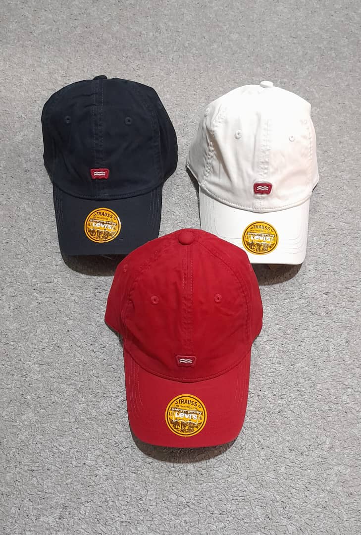 a red fire hydrant in a parking lot 