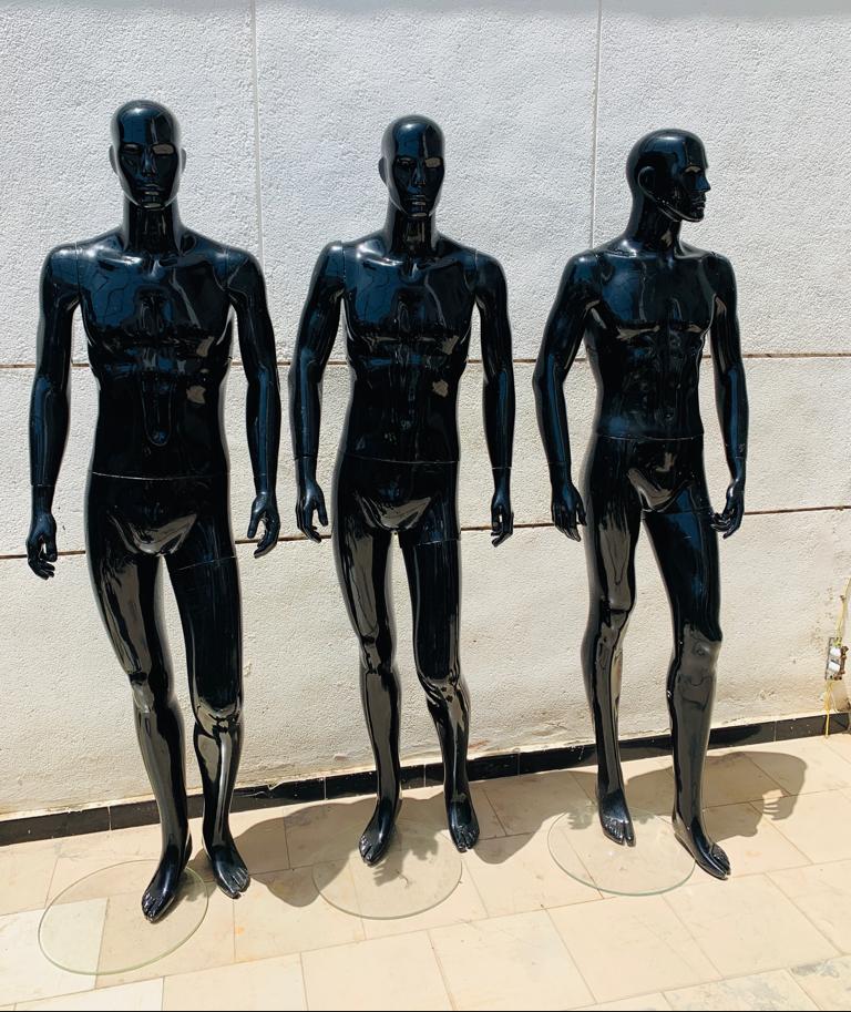 a group of people standing on top of a beach 