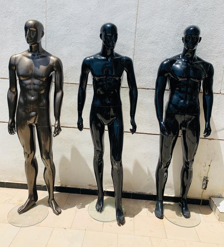a group of people standing on top of a beach 