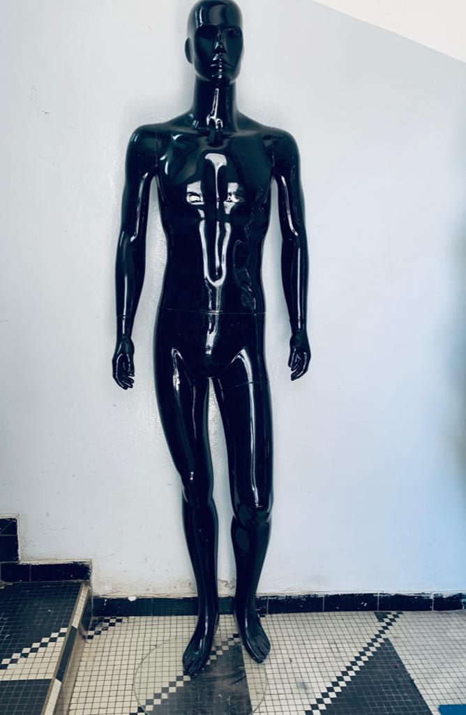 a couple of people standing on top of a conveyor belt 