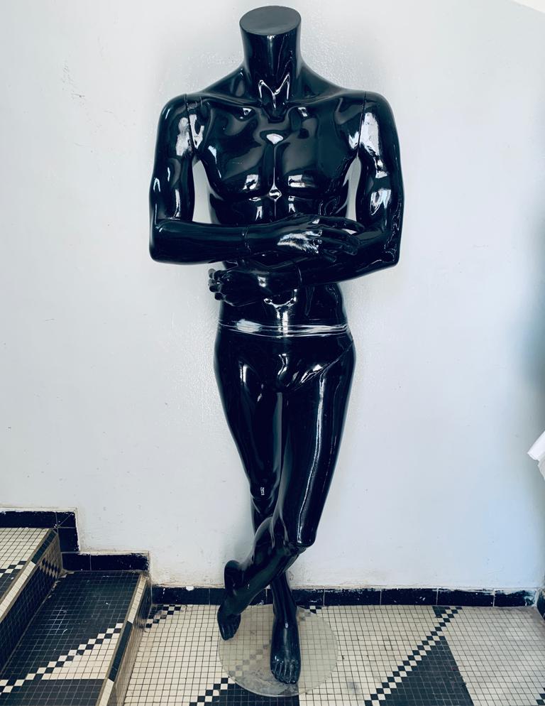 a man in a uniform standing on a train 