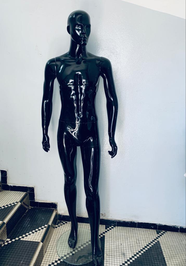 a couple of men standing on top of a train 