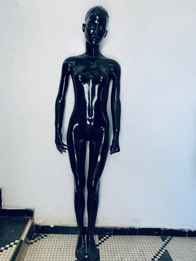 a black and white photo of a person with a tennis racket 