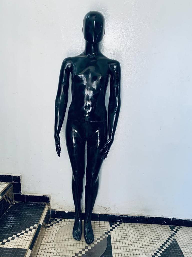 a man is standing on a stage with a baseball bat 