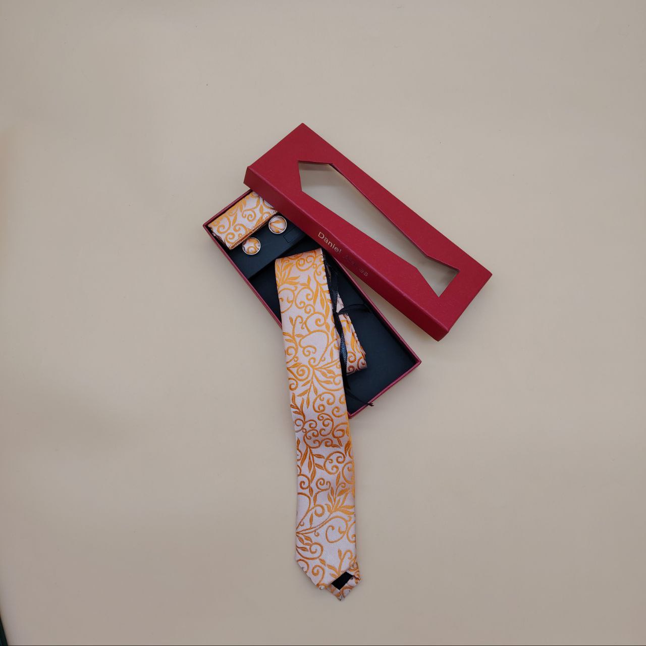 a close up of a person wearing a red tie 