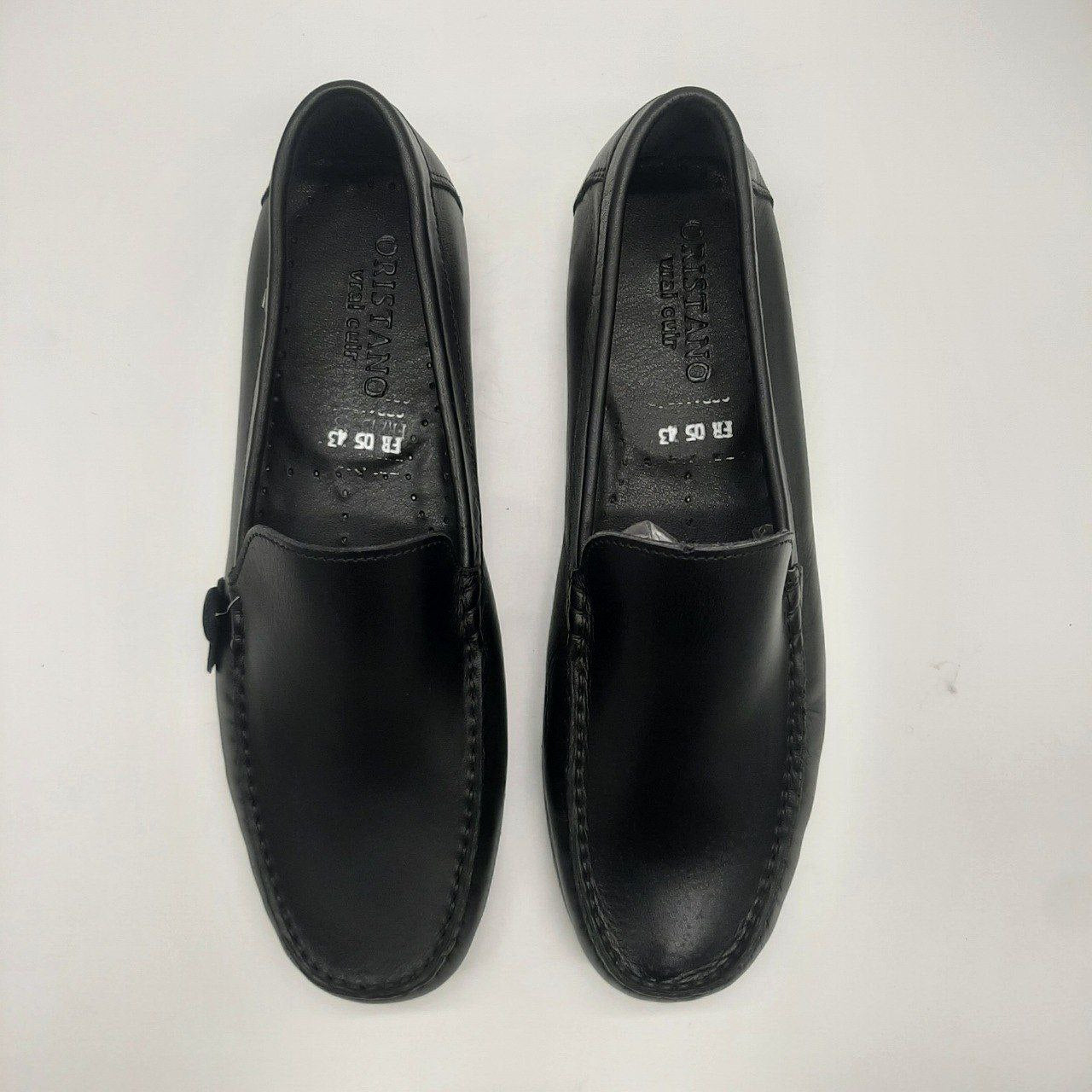 a pair of shoes sitting next to a pair of shoes 