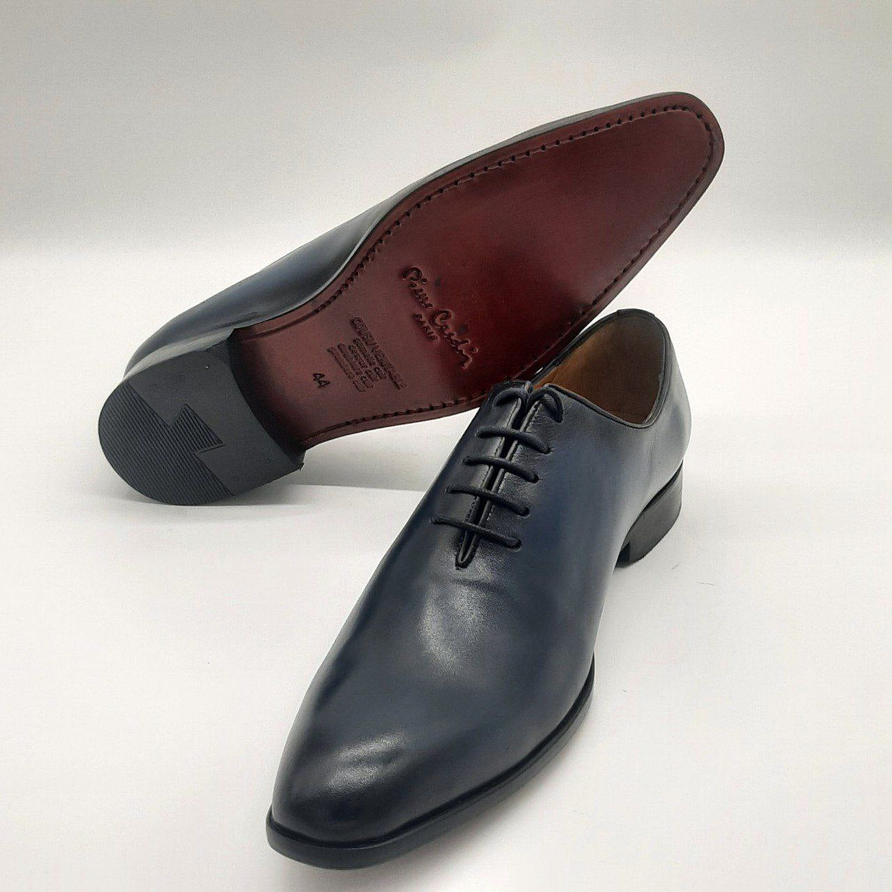 a close up of a pair of shoes on a floor 