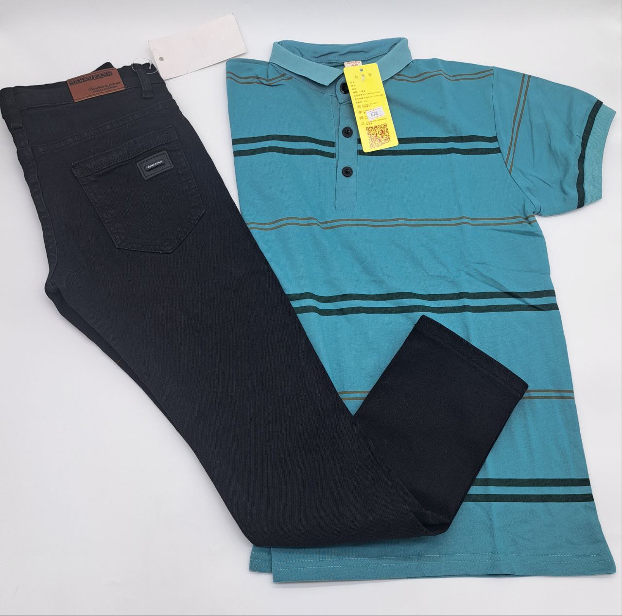 a blue piece of luggage sitting on top of a bed 