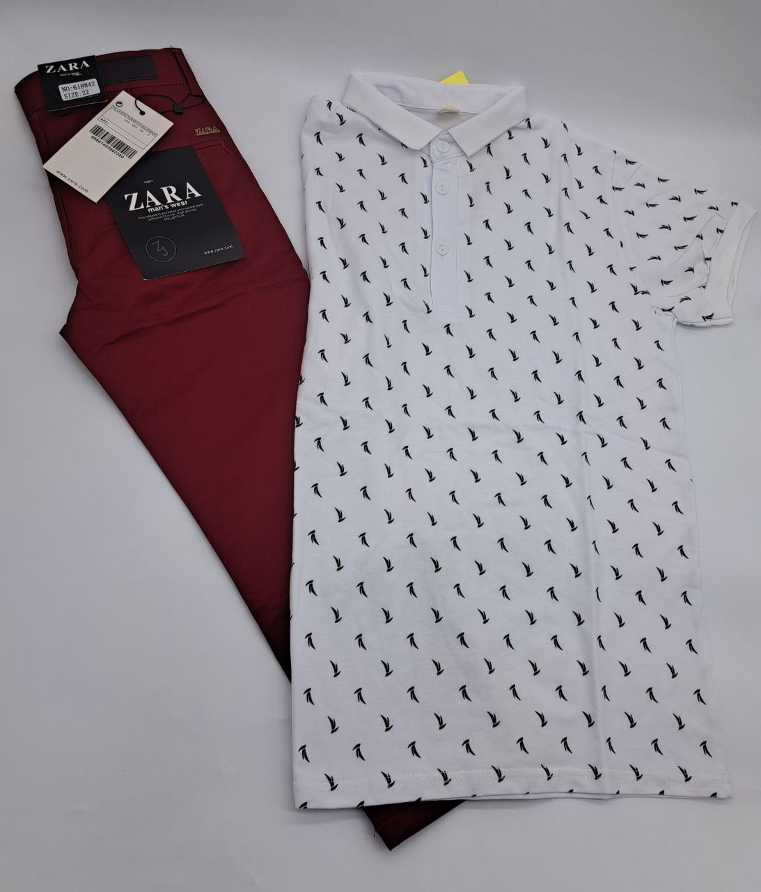 a red white and black tie hanging on a wall 