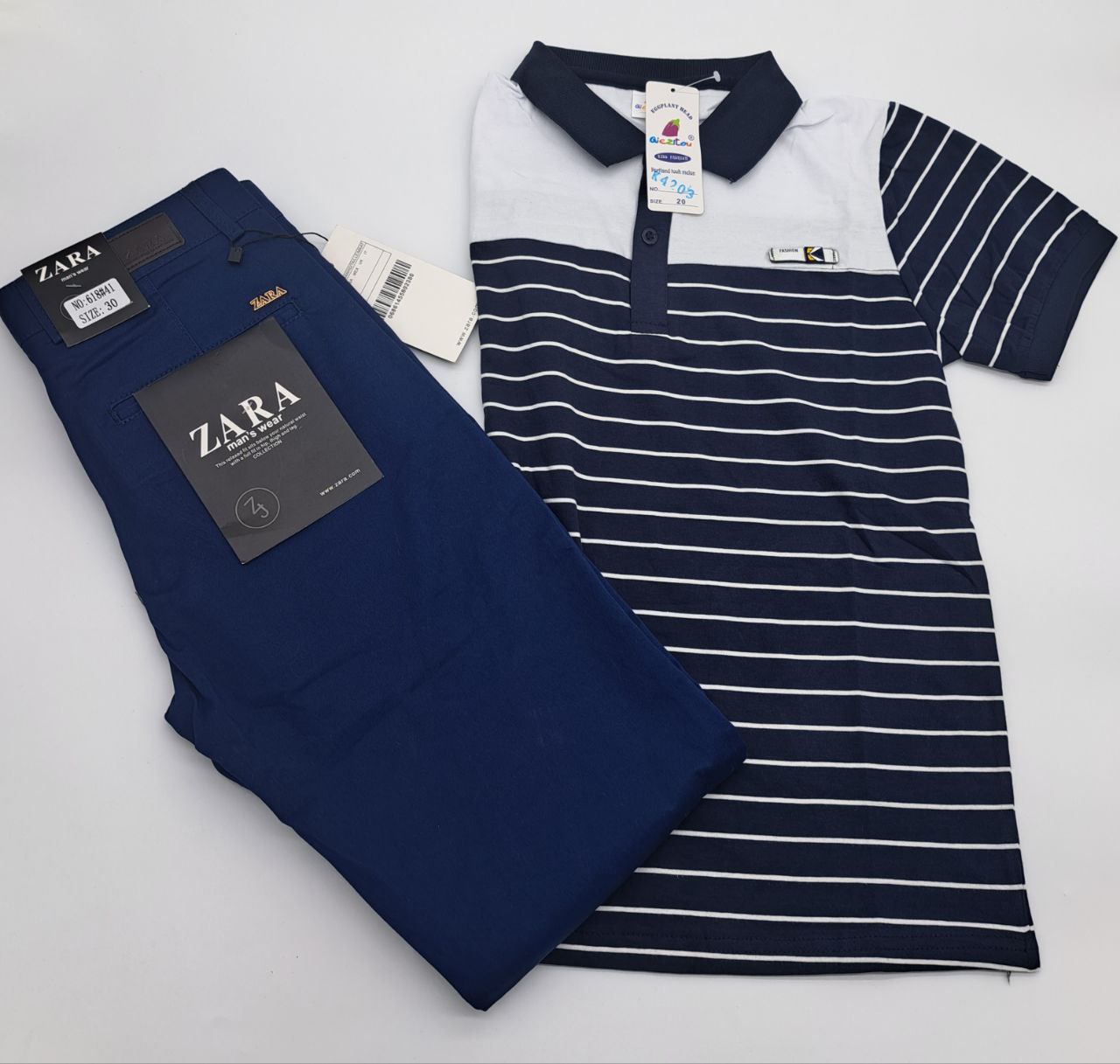 two black and blue umbrellas are on a white surface 