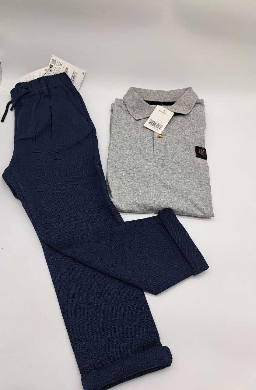 a person wearing a blue coat and a kite 