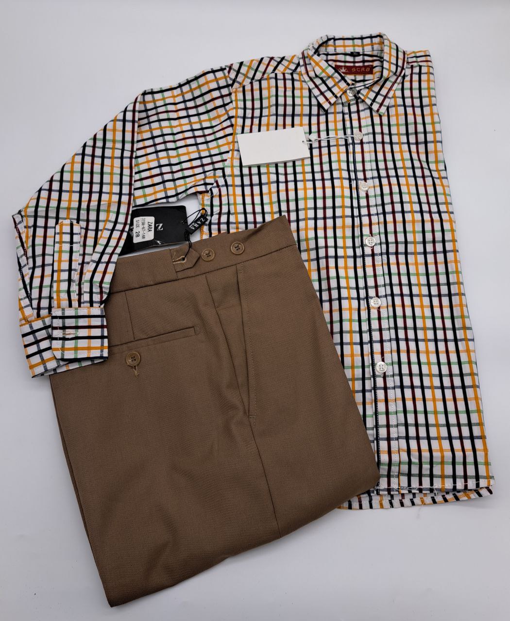 a piece of luggage sitting on top of a bed 