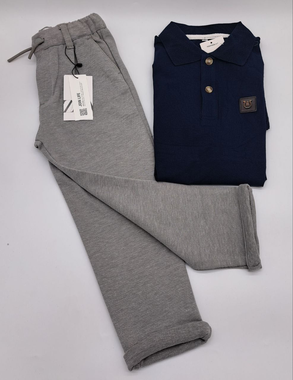 two pieces of luggage sitting on a white surface 