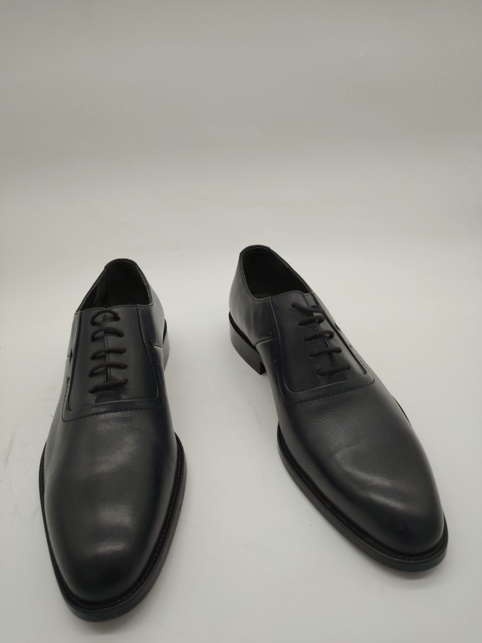 a pair of shoes and a pair of black shoes 