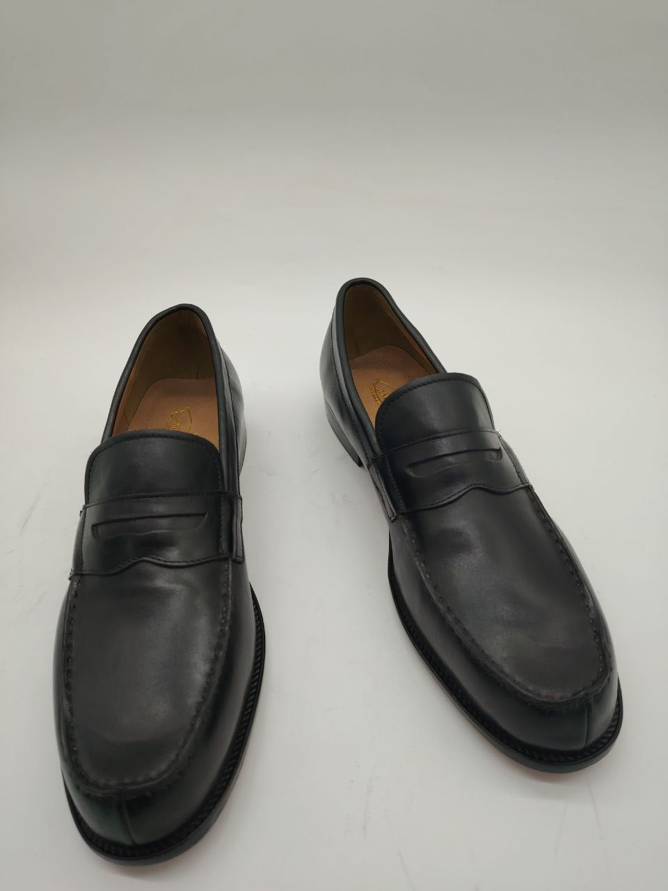 a pair of shoes and a pair of black shoes 