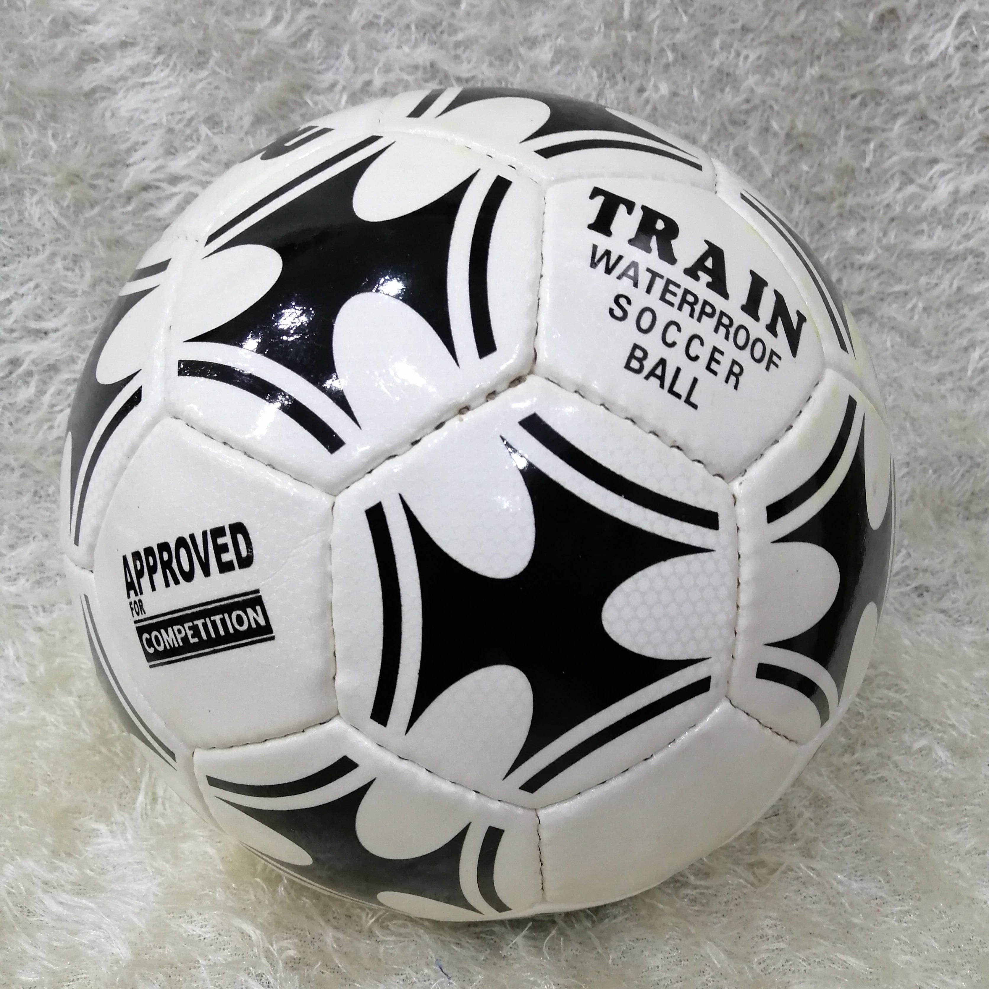 a black and white photo of a soccer ball 